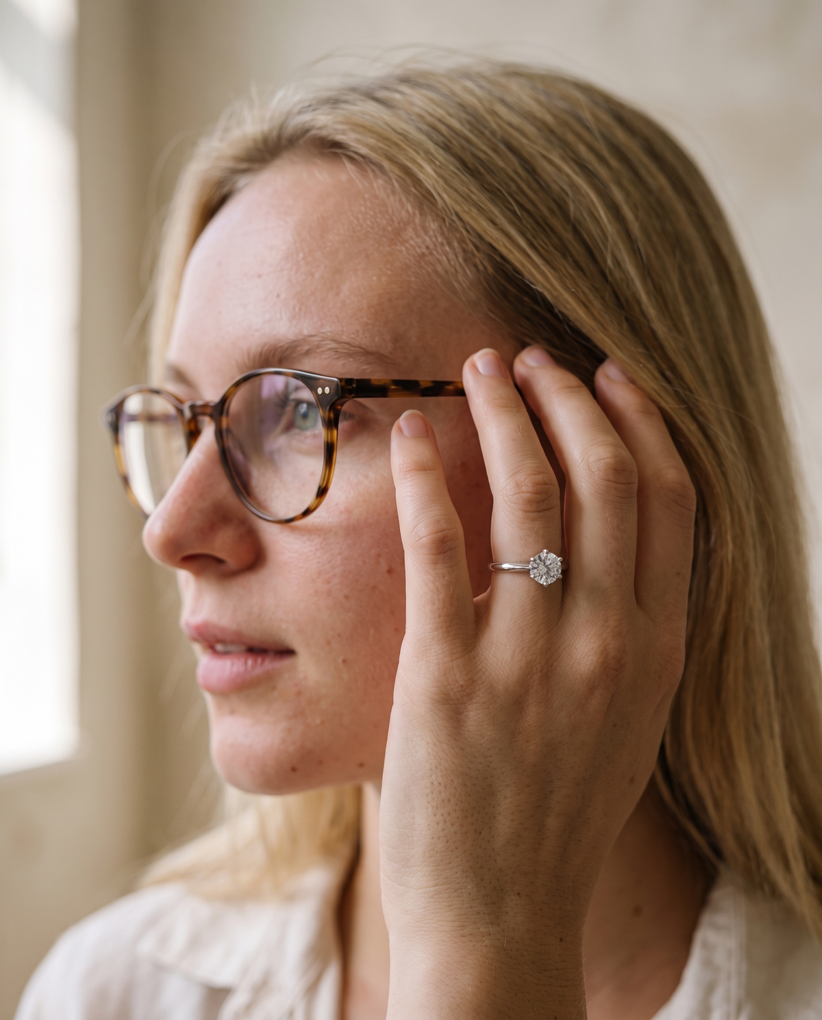 Classic moissanite solitaire ring worn