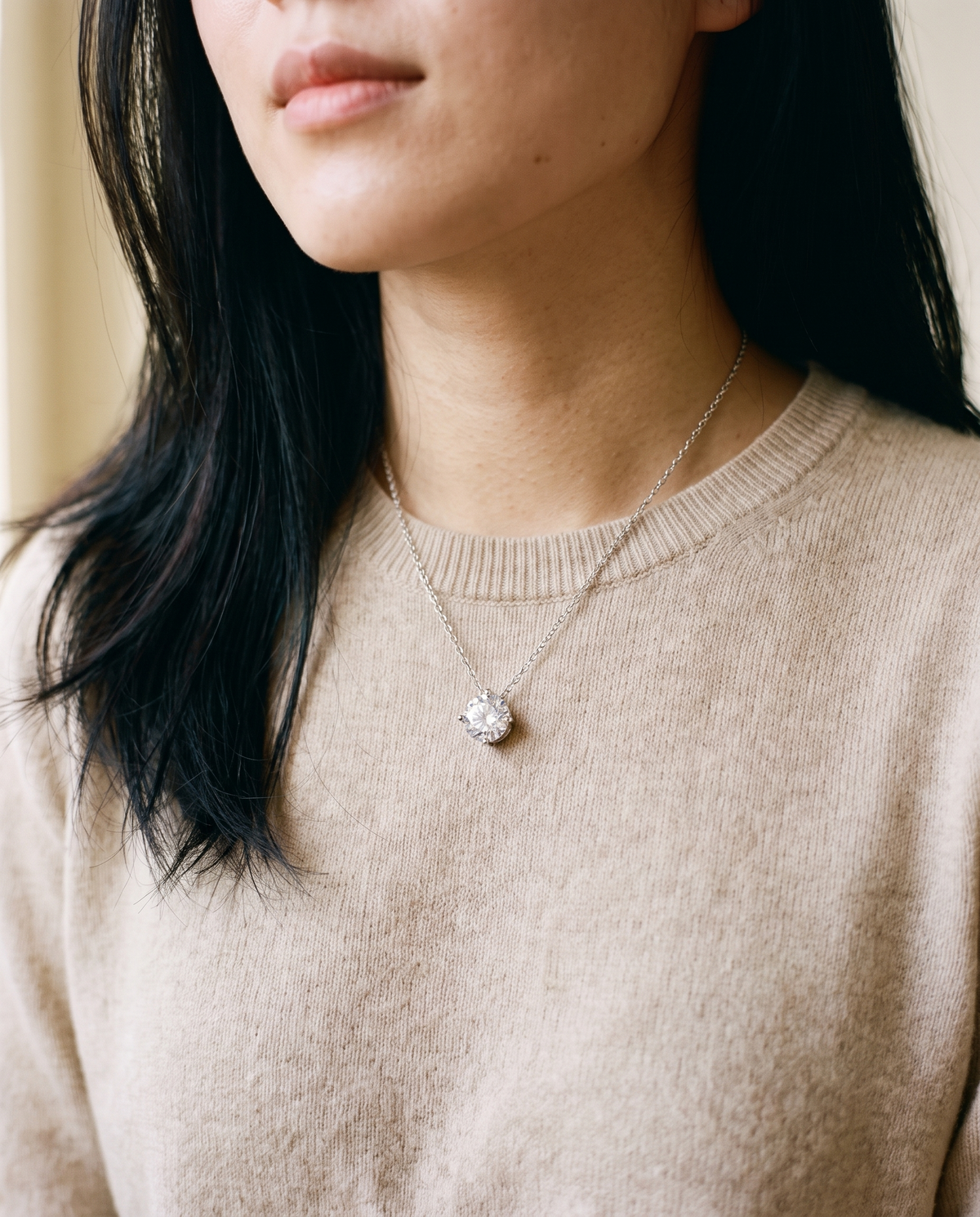 Solitaire moissanite necklace worn