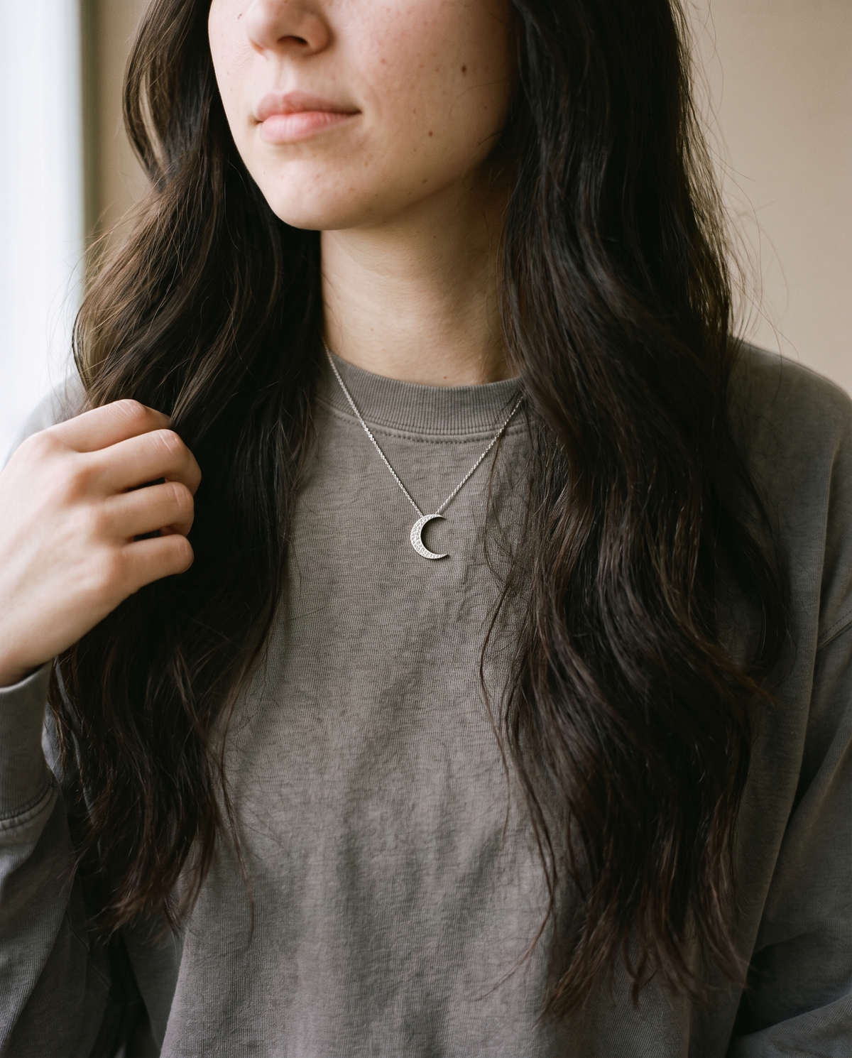 Crescent moon moissanite necklace worn